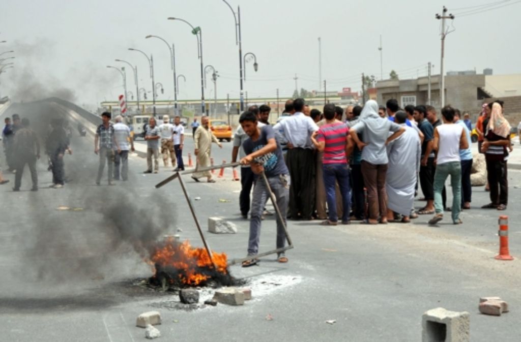 Gewalttätige Straßenproteste im Norden des Irak Foto: DPA