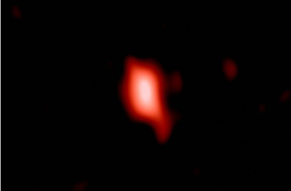 Dieses Bild zeigt die Galaxie MACS1149-JD1, wie sie vor 13,3 Milliarden Jahren aussah und nun vom Alma-Observatorium der Europäischen Südsternwarte (ESO) in Chile beobachtet wurde.