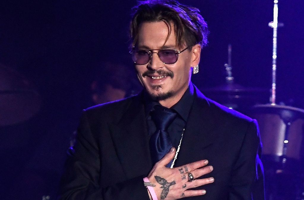 Johnny Depp ist nach dem Konzert und der Auszeichnung zu seinen Ehren ganz gerührt. Foto: AFP