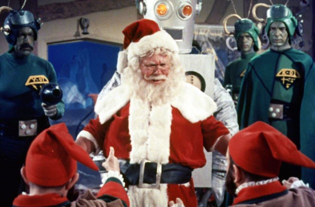 ... allen Ernstes ein Weihnachtsfilm für die ganze Familie sein. Eine Gruppe grüner Männer vom Mars und deren Pappkarton-Roboter kidnappen den Nikolaus und zwei Erdkinder. Das gerät zu einer derartigen Farce, dass man sich wundert, ob Kinder da nicht auf Jahre hinaus die Lust am Filmschauen überhaupt verlieren. Für Erwachsene ist dieses Teil aber die ultimative Mut- und Ekelprobe: Wer kann es am Stück verkraften?Hier ist der Trailer zu sehen.