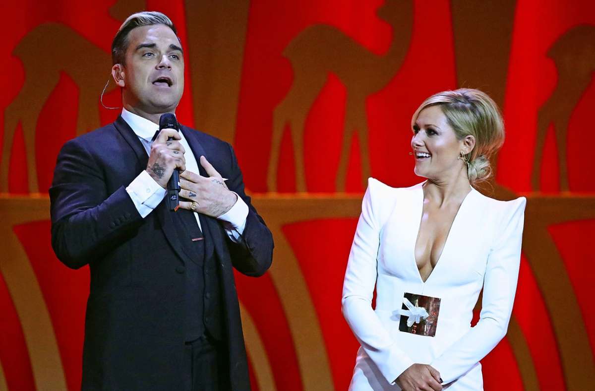 Robbie Williams  und Helene Fischer (Archivbild) Foto: dpa/Michael Kappeler